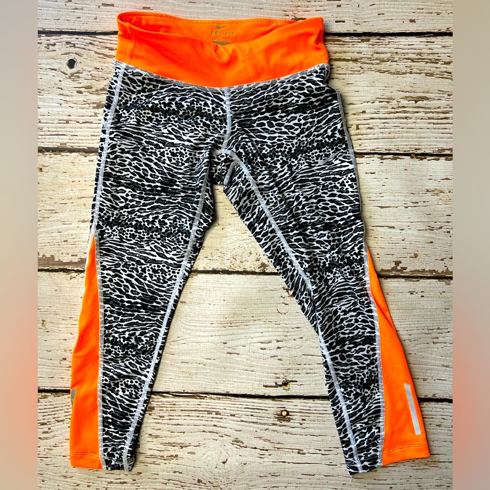 Nike Women’s XS leggings. Zebra print with neon orange accents.Brand new w/o tag